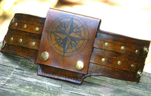 strappy brown leather wrist wallet cuff for bikers and travelers with secret pocket